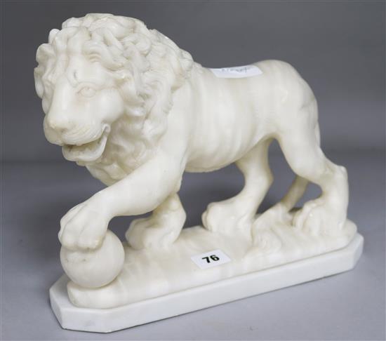 An alabaster lion on a stand